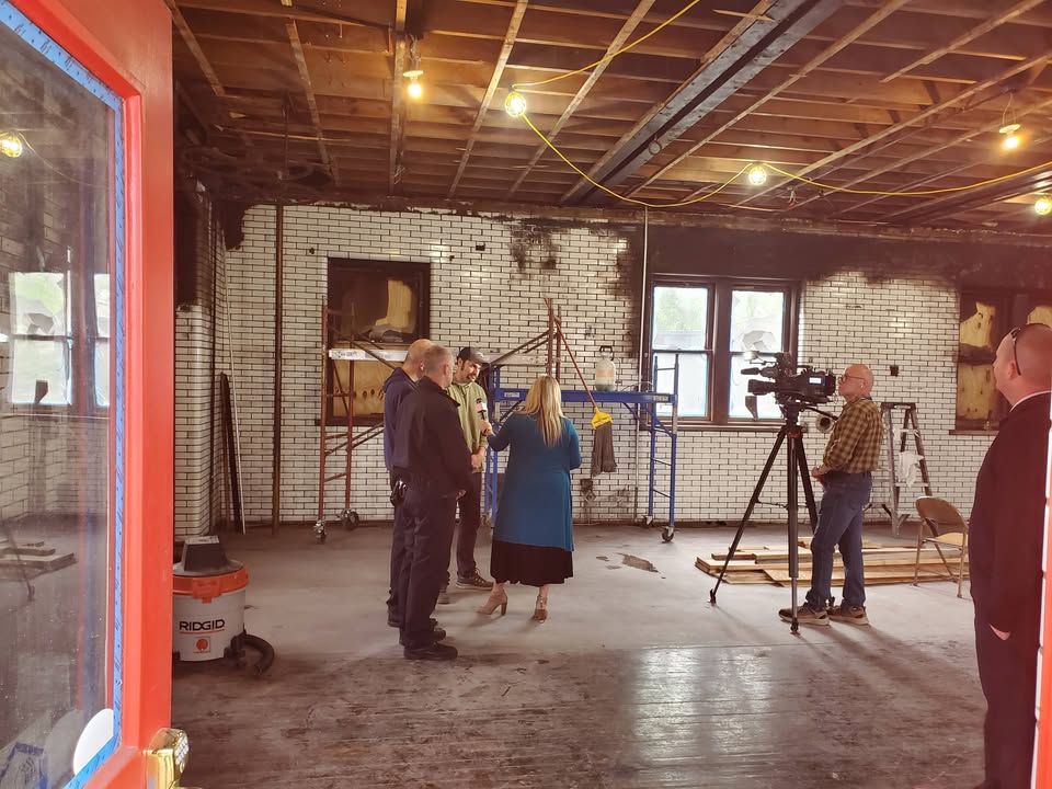 Firefighters with local news media