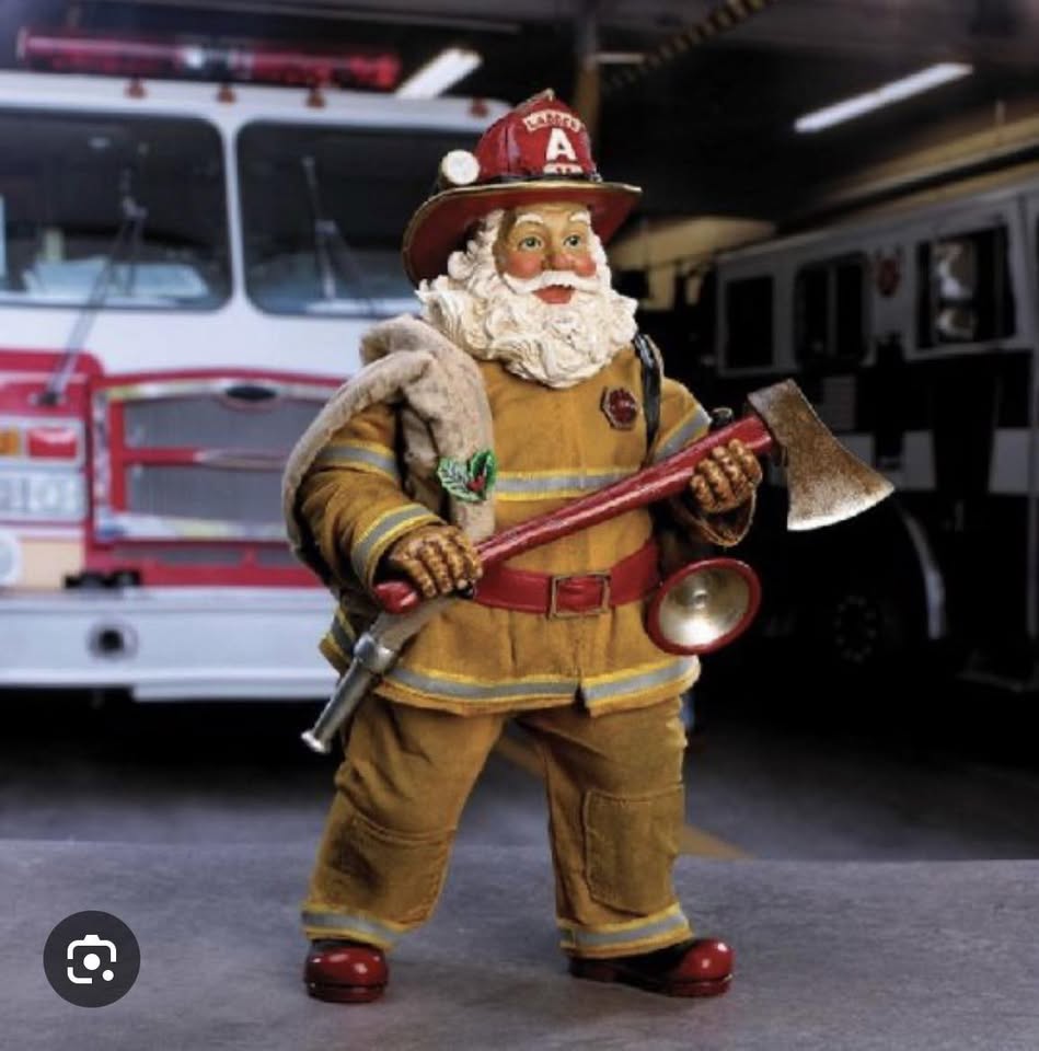 Firefighter Santa at the station